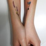 Delicate violet and blue flower tattoos