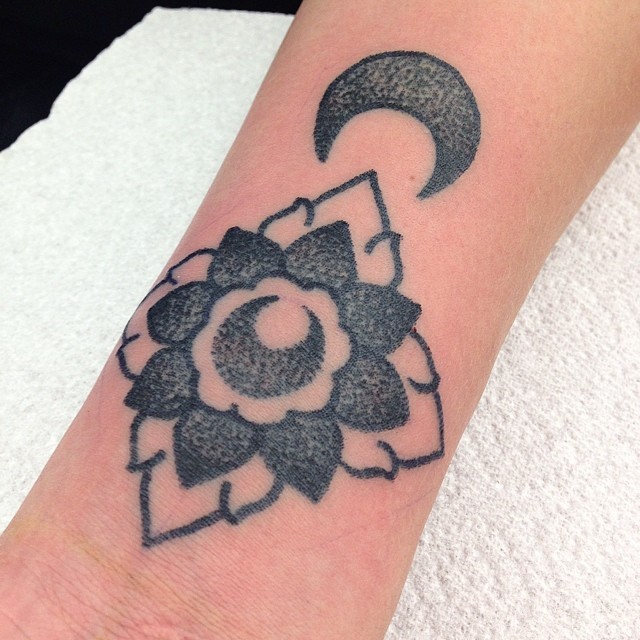 Dotwork flower and crescent moon tattoo