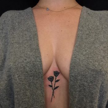 Double black rose sternum tattoo