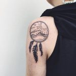 Dreamcatcher tattoo on the left shoulder