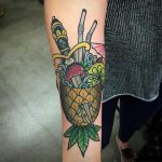 Exotic cocktail and dagger tattoo