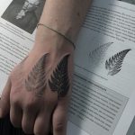 Fern leaves tattoo on the hand