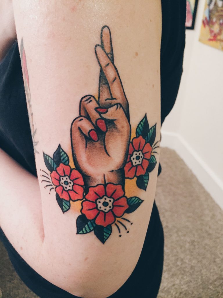Fingers crossed tattoo