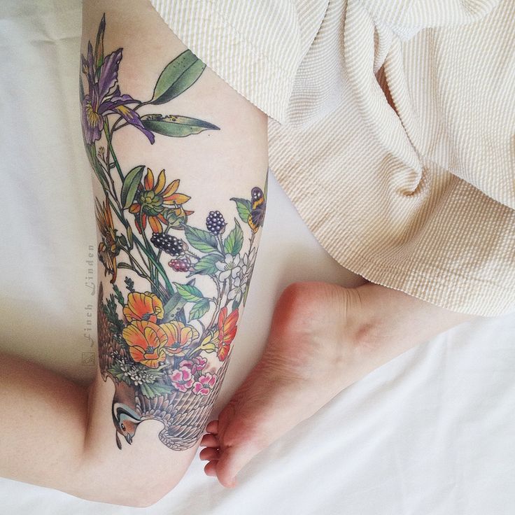 Floral tattoo on the right thigh