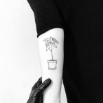 Flower in a pot minimalist style tattoo