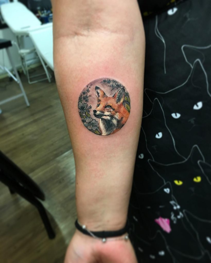 Fox in a circle tattoo