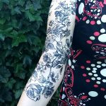 Geometric roses tattoo on the arm