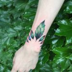 Gorgeous green leaves tattoo