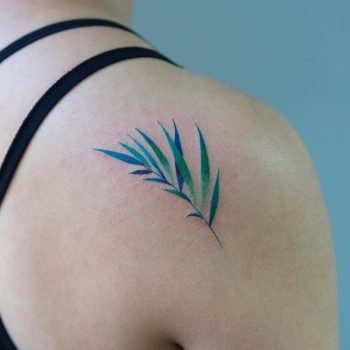 Green branch with leaves tattoo