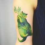 Green cat tattoo