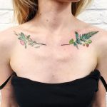 Green plant tattoos on collarbone