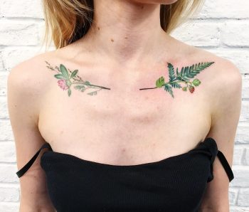 Green plant tattoos on collarbone