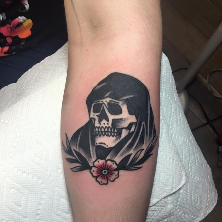 Grip reaper with a flower tattoo