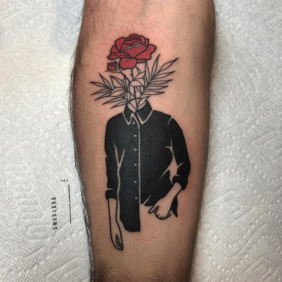 Guy with a flower on his head tattoo