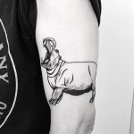 Hippo tattoo on the arm