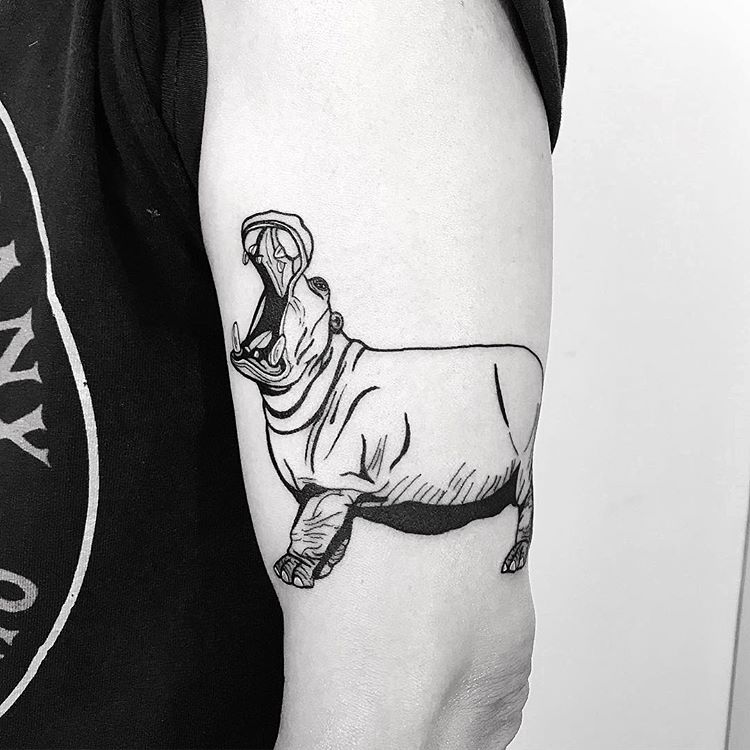 A hippo head with a detailed realistic full moon on upper right corner and  wintersweet flower on lower left corner tattoo idea | TattoosAI