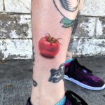 Hyper realistic tomato tattoo