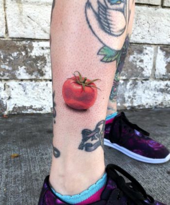 Hyper realistic tomato tattoo