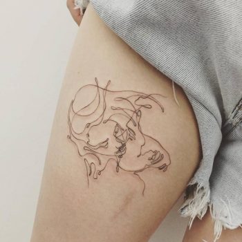 Kissing couple tattoo