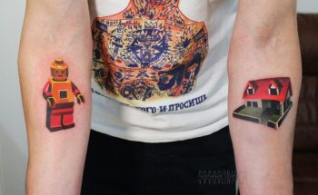Lego mini figure and house tattoo