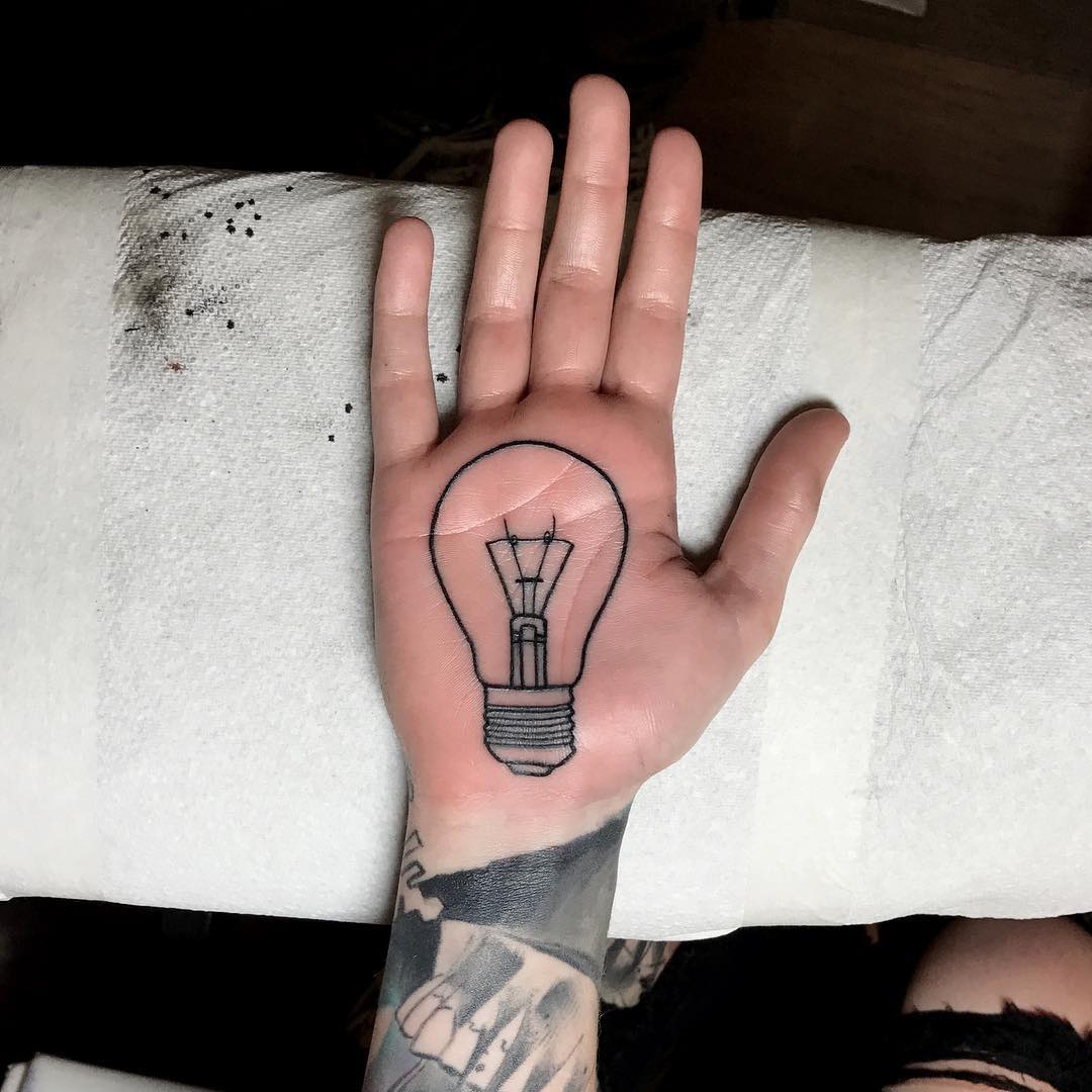 Lightbulb palm tattoo