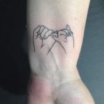 Linear pinky promise tattoo