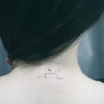 Little leo constellation and crescent moon tattoo on the neck