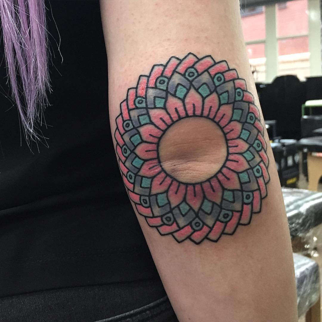 Lovely mandala on the elbow tattoo