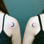 Matching crescent moon tattoos on shoulders
