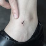 Micro ant tattoo on the ankle