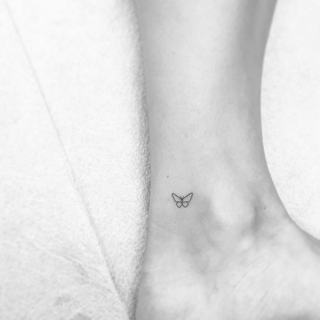 Micro butterfly tattoo on the ankle