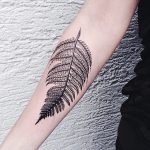Monochrome black fern leaf tattoo