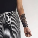 Monstera leaves tattoo on the inner forearm