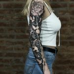 Negative space full sleeve rose tattoo