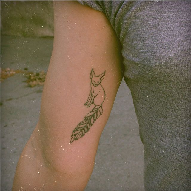 Outline fox tattoo with a long tail