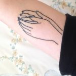 Outline hands tattoo