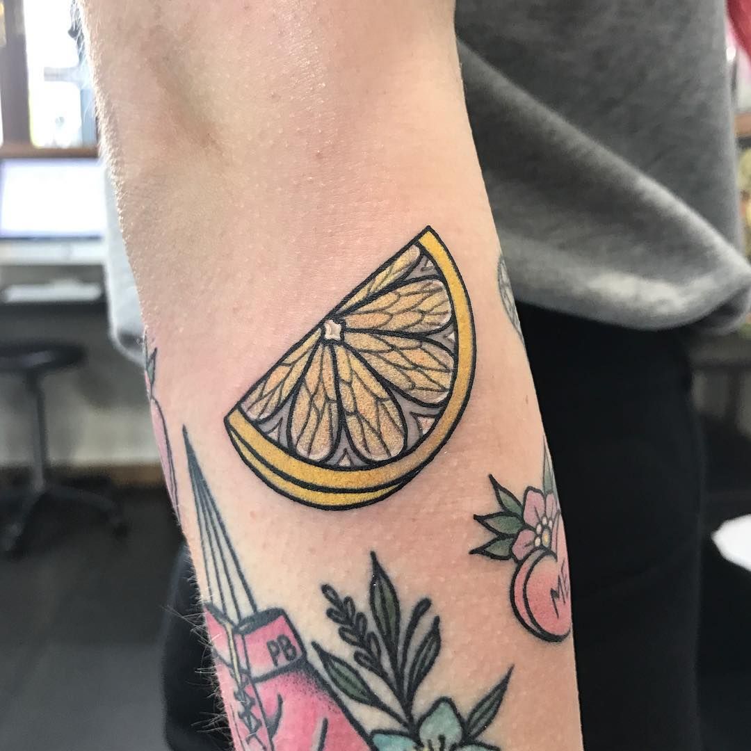 Piece of lemon tattoo