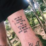Quote tattoo on the thigh