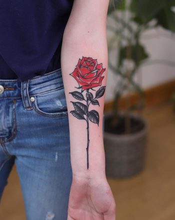 Realistic rose forearm tattoo