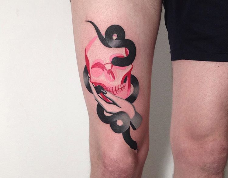 Red skull and black snake tattoo