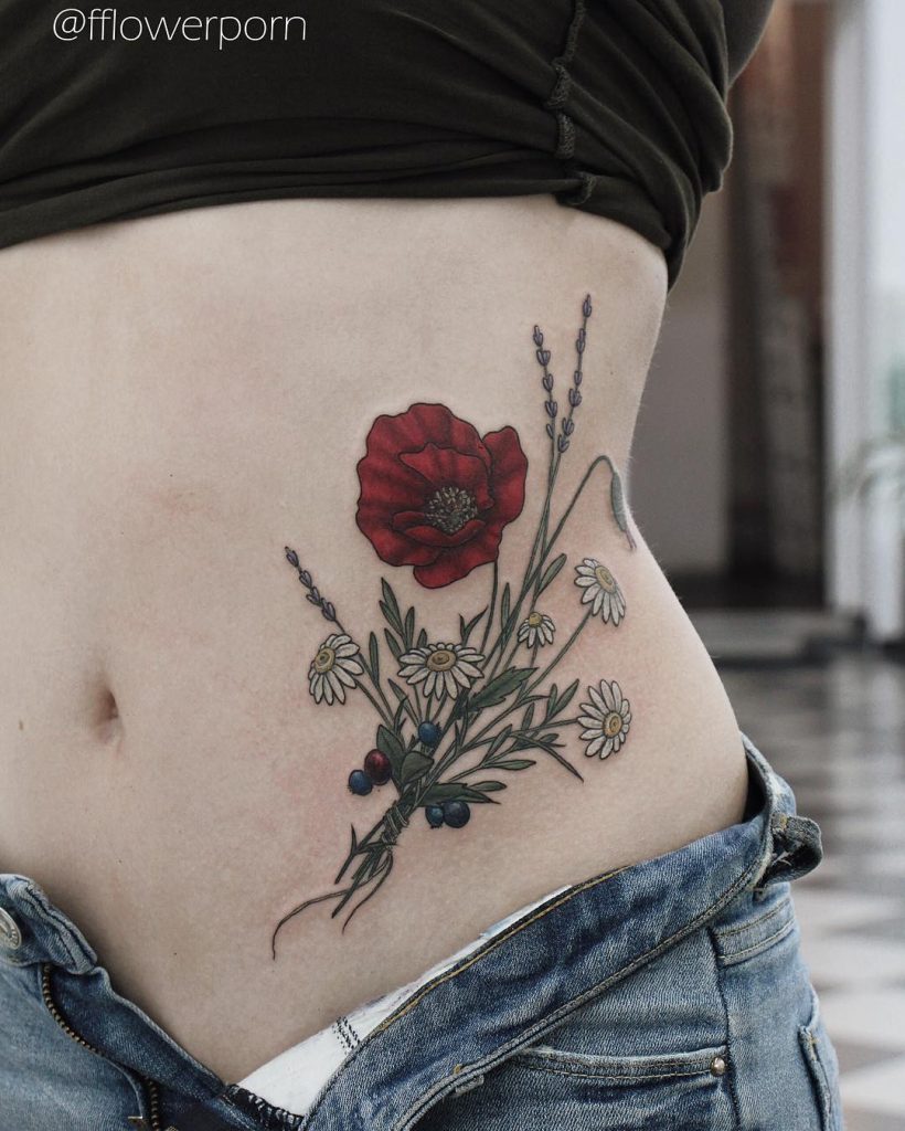Red wildflower tattoo on the belly 