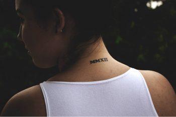 Roman numerals mmxii tattoo