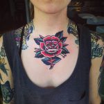 Rose tattoo on the chest and neck