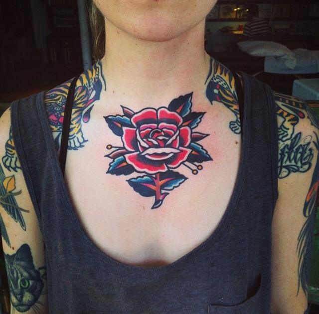 Rose tattoo on the chest and neck