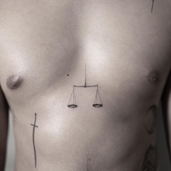 Scales sternum tattoo