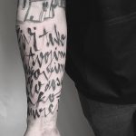 Script tattoo on the forearm