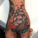 Ship tattoo on the thumb and hand