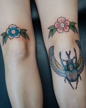 Simple flower knee tattoos