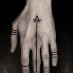 Simple thin line tattoo on the hand