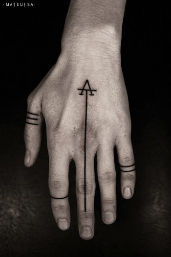 Simple thin line tattoo on the hand